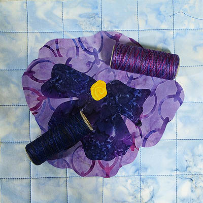 Hand dyed threads for stitching around flower shape