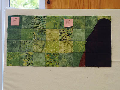 Green, black and brown squares of fabric