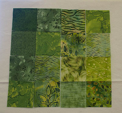 16 green squares of fabric
