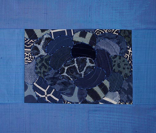 Variety of oval shaped blue fabrics to create the waters of cottage country framed in blue