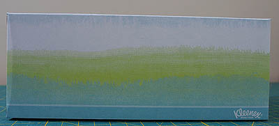 Three coloured tissue box in turquoise, lime green and white