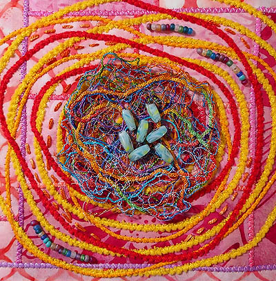 Beads and embroidery added to squared off piece