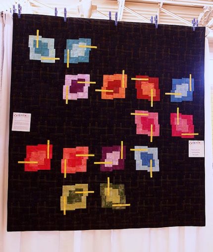 black chopstix quilt with multi coloured blocks