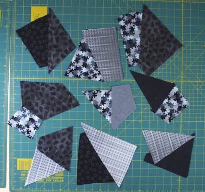Pairs of odd shaped fabric in grey and black