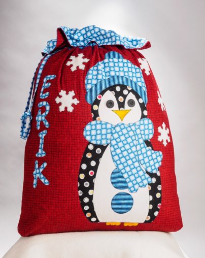 Red santa sac with penguin applique