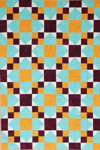 teal, plum and orange squares of fabric