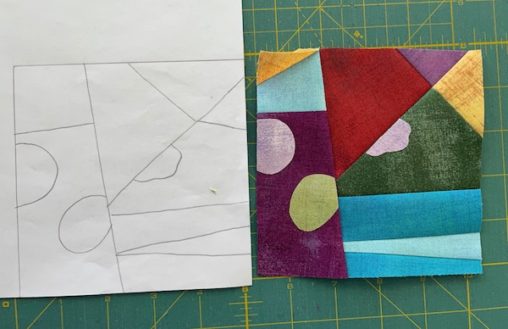 pencil line drawing beside multi fabric pieced block