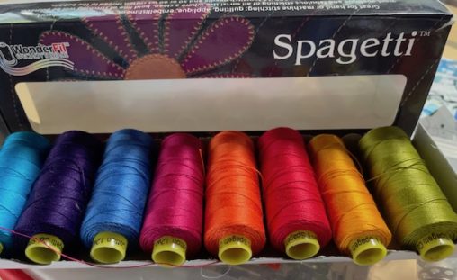 spools of thread in many bright colours