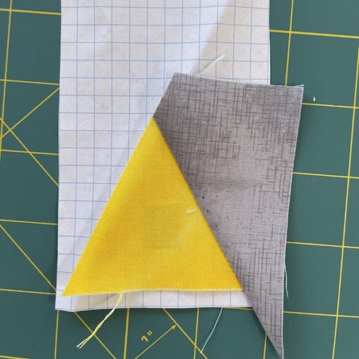 Yellow and grey fabric on graph paper