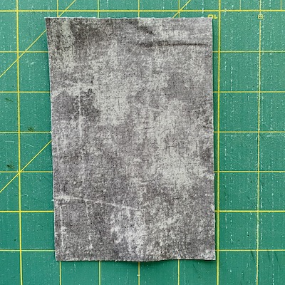grey fabric on green mat