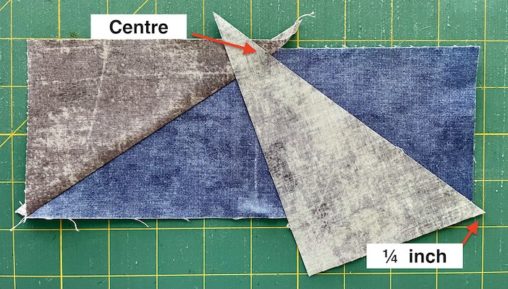 grey triangle on blue fabric