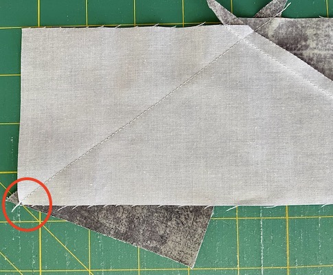red circle at corner of fabric showing alignment