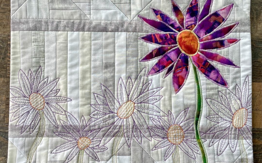 purple flower on grey background surrounded by purple thread flowers