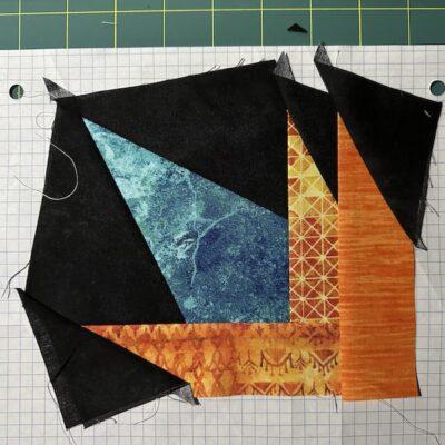 black, teal and orange fabric on paper