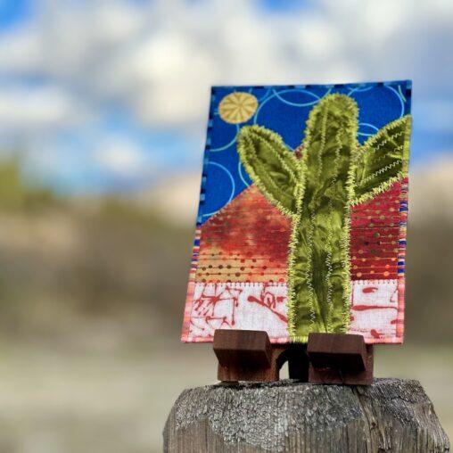 Saguaro postcard on a post