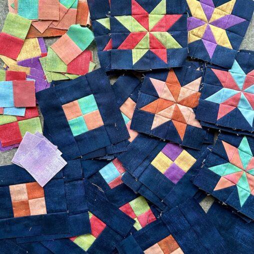 multi coloured stars on blue background and 4 patch blocks