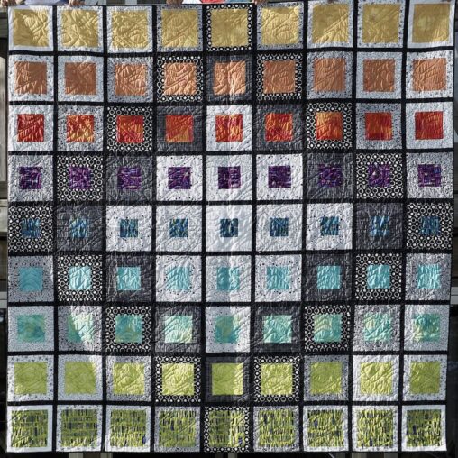 colourful squares framed with white & grey fabrics then framed again with black fabric